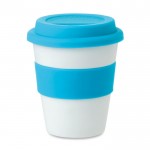 Obrázek Plastový pohár se světle modrým víčkem a úchopem